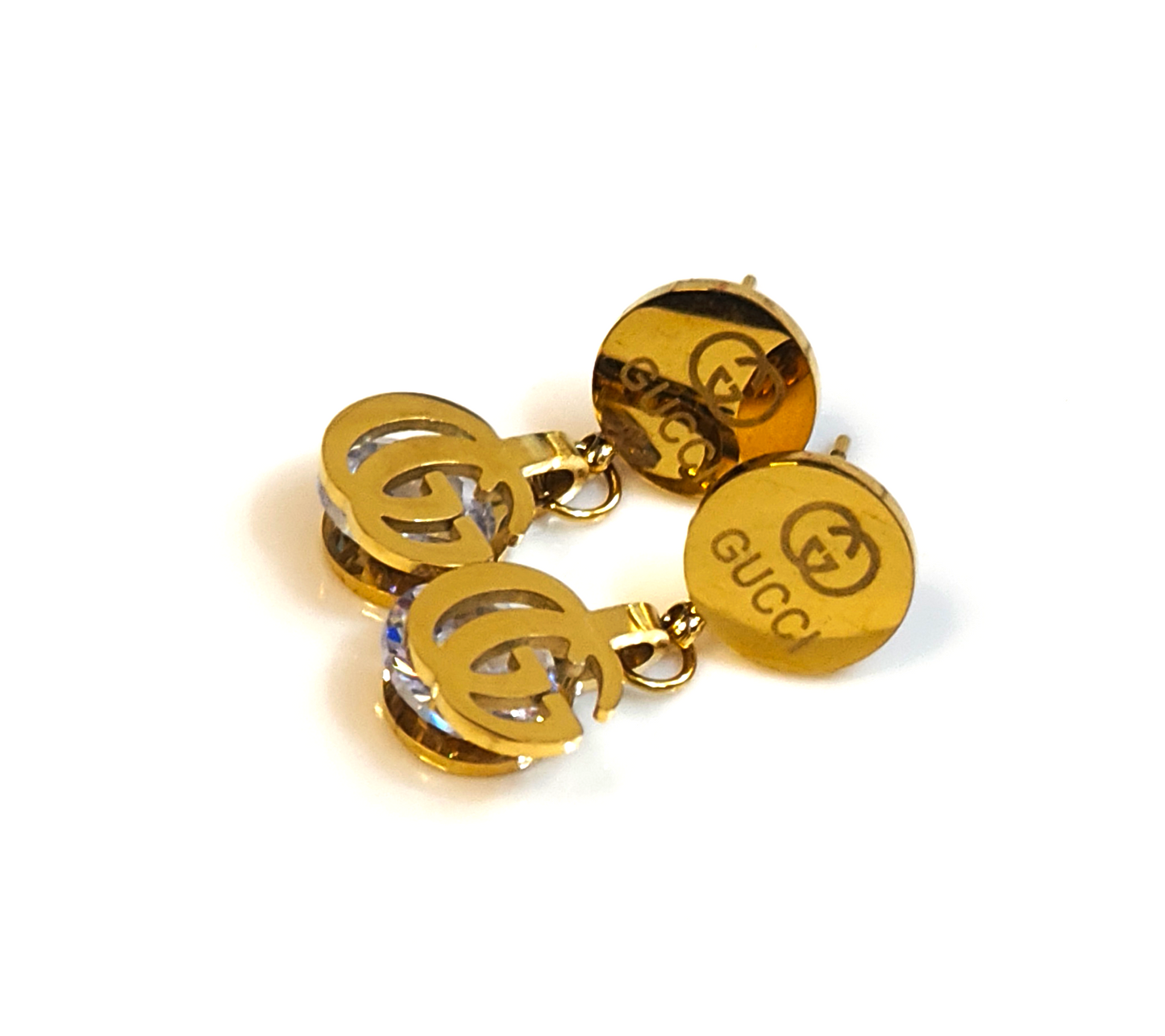 Gold earrings with a brand logo on a white background